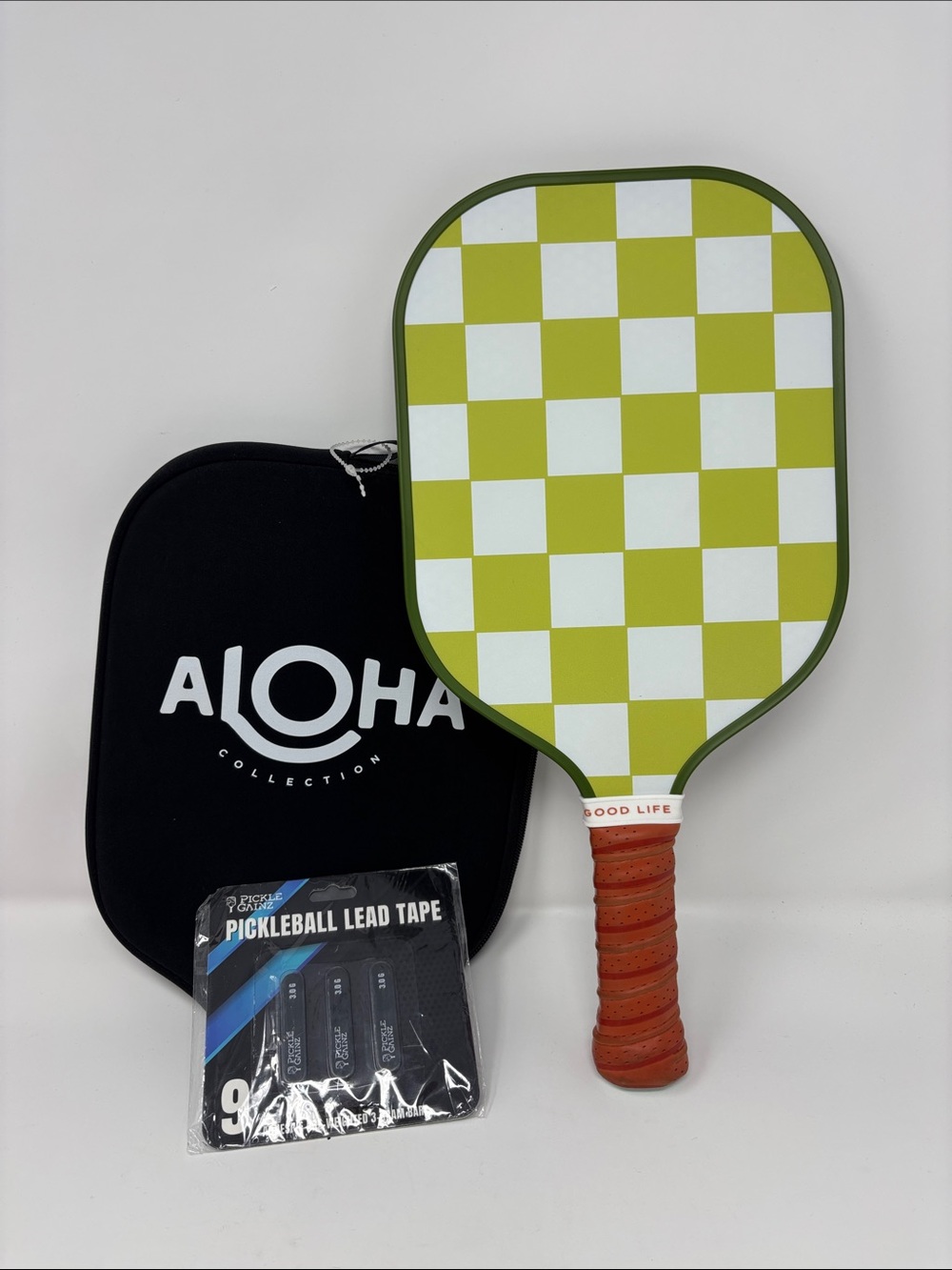 ALOHA Collection Paddle Cover in Black with Orange Grip green paddle pickleball